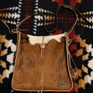 Cute book/messenger bag with cowhide and leather.